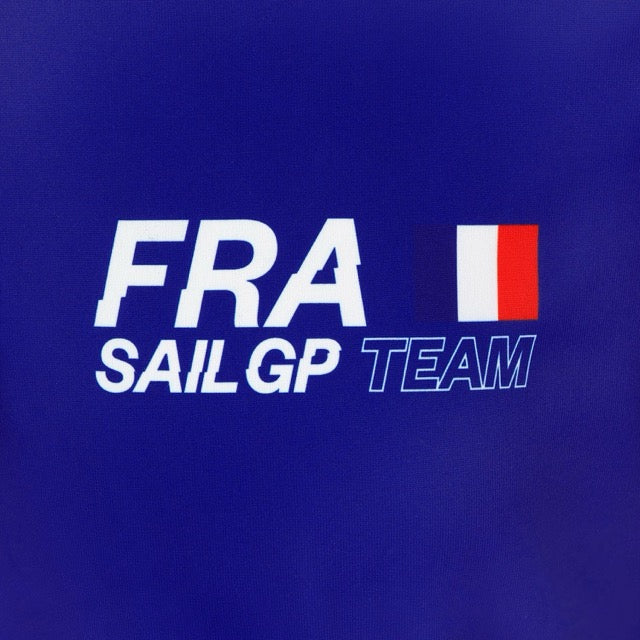 Close-up of the FRA SailGP Team logo on a blue polo