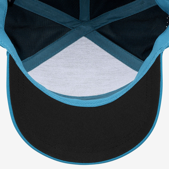 Close-up of a cap with blue rim and white mesh on a white background