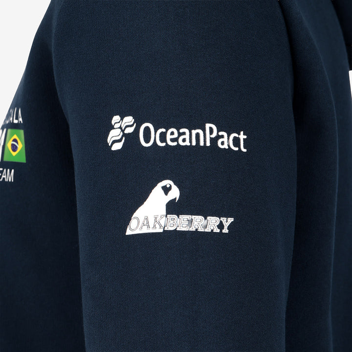 Close-up of Navy blue Mubadala Brazil SailGP Team hoodie with OceanPact and Oakberry logos on a white background